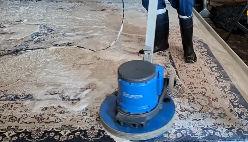 PureNest technician performing the agitation step of carpet cleaning in Medford, OR