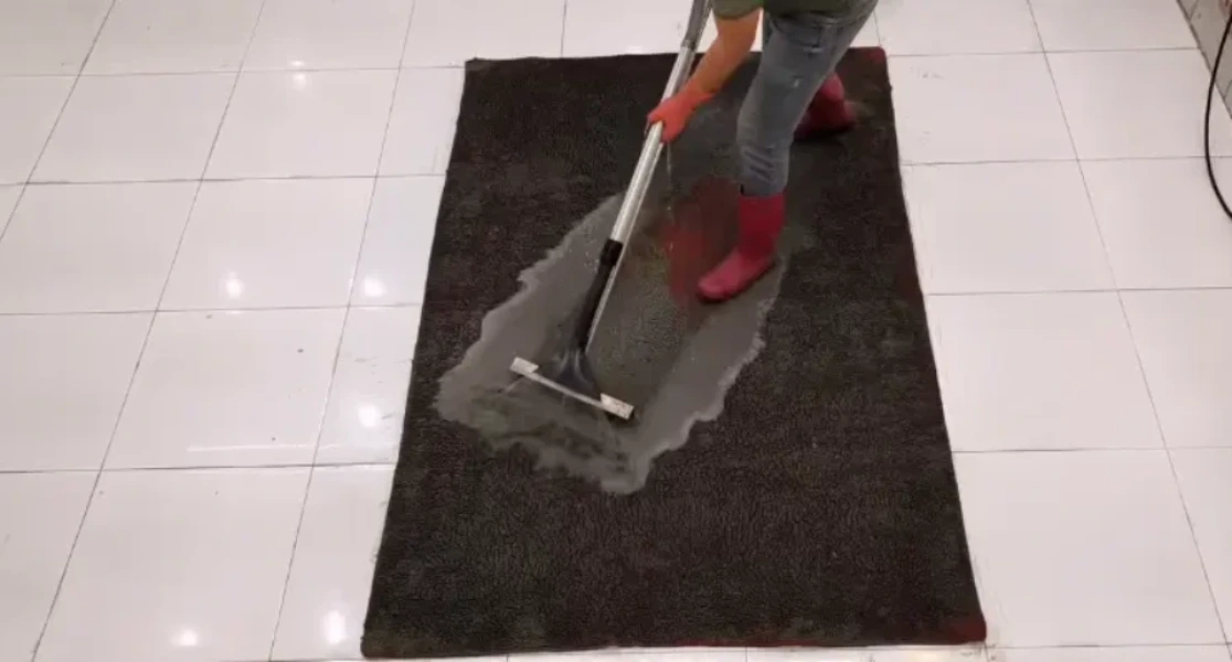 PureNest technician performing hot water extraction step of carpet cleaning in Medford, OR